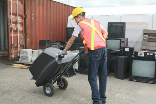 Operatives wearing PPE during rubbish removal